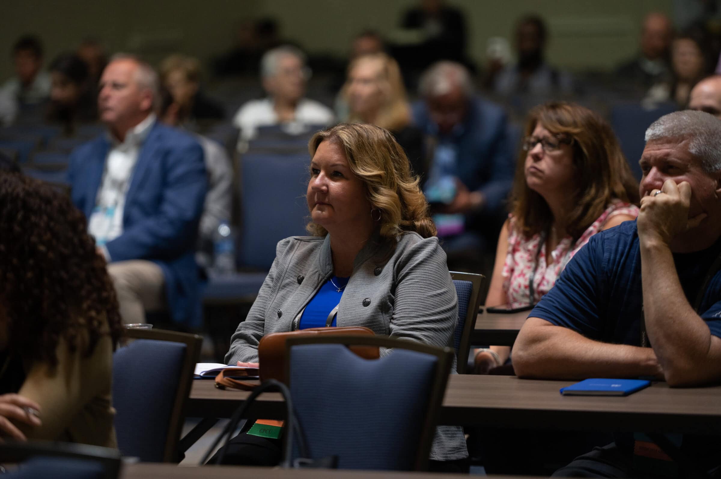 NAMIC Day Three people listening to a educational session